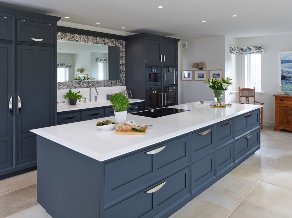 Inspiration for a mid-sized transitional galley kitchen in Other with shaker cabinets, blue cabinets, mirror splashback, black appliances, with island, beige floor, beige benchtop and an undermount sink.