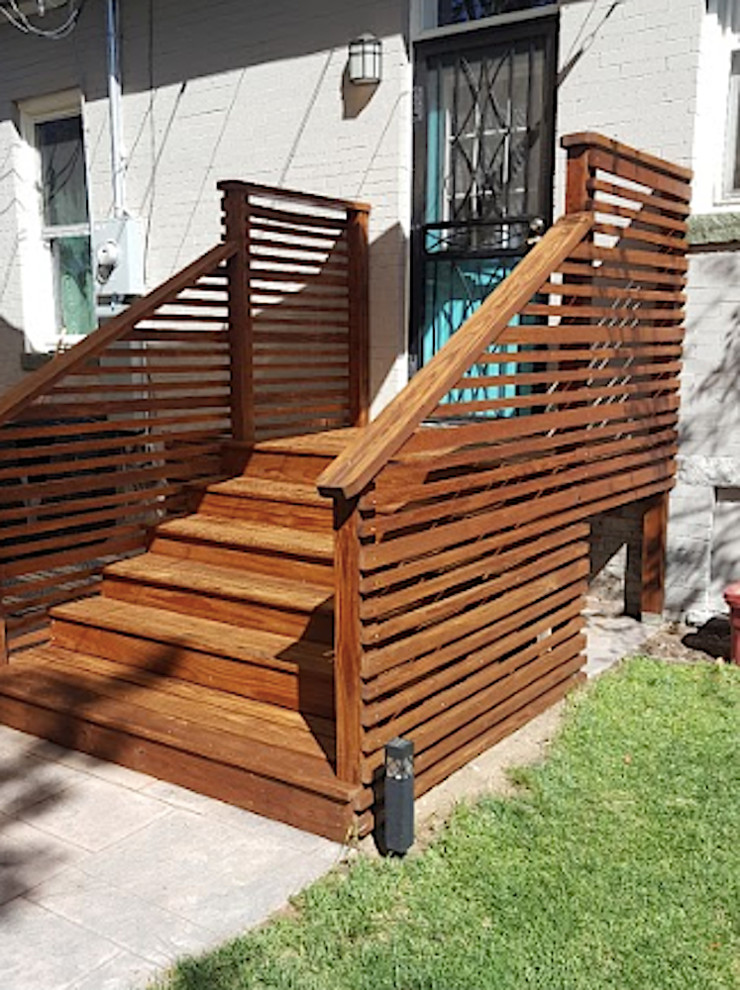 Inspiration for a small transitional front yard staircase remodel in Denver with decking