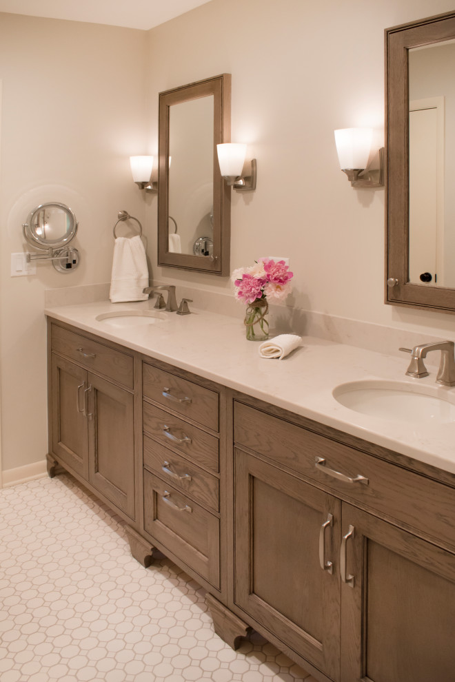 Inspiration for a mid-sized transitional master mosaic tile floor and beige floor bathroom remodel with furniture-like cabinets, medium tone wood cabinets, beige walls, an undermount sink, quartz countertops and beige countertops