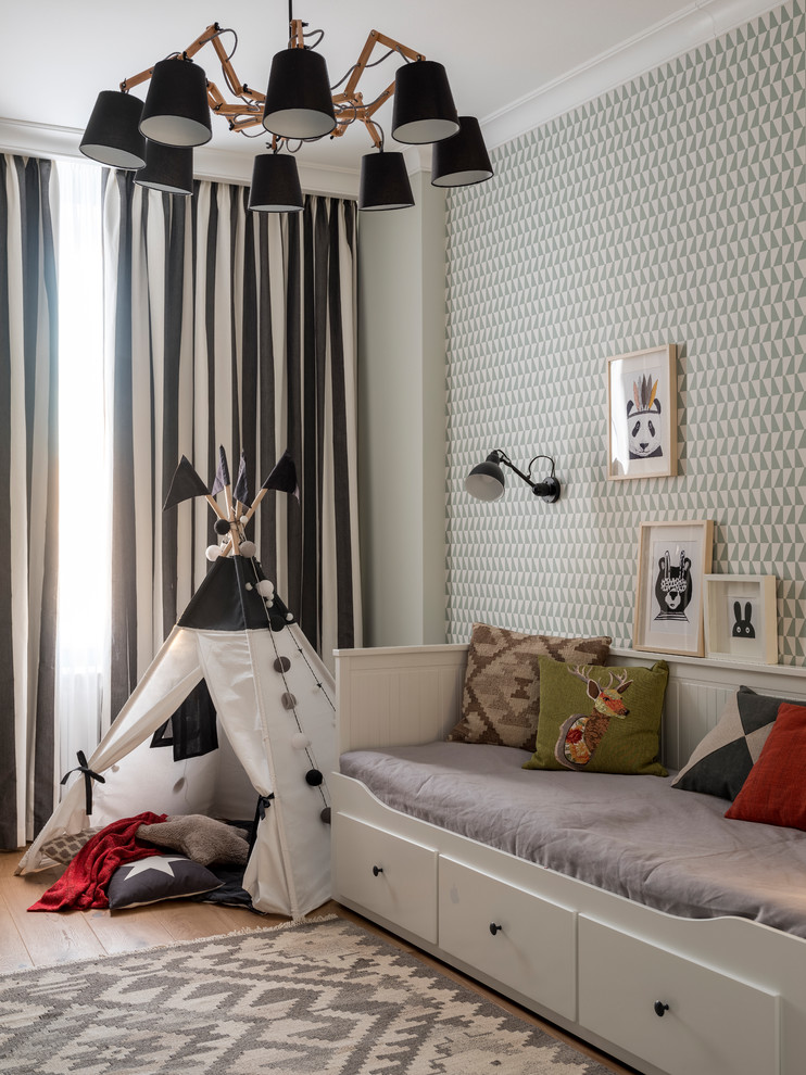 Photo of a scandinavian gender-neutral kids' bedroom in Moscow with medium hardwood floors and brown floor.