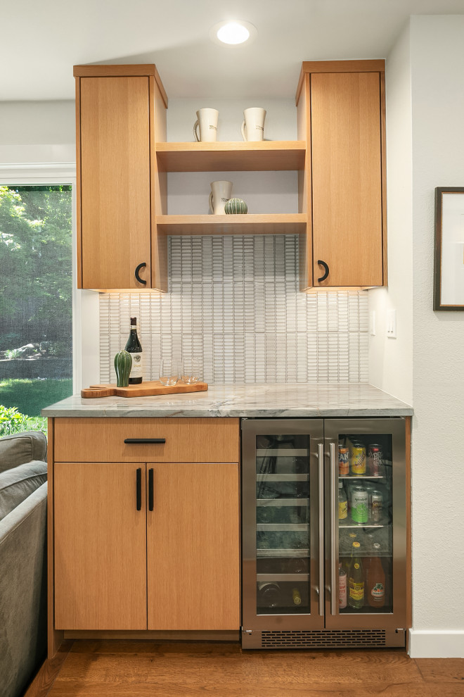 Large 1960s single-wall medium tone wood floor and brown floor dry bar photo in Seattle with flat-panel cabinets, medium tone wood cabinets, quartzite countertops, multicolored backsplash, porcelain backsplash and multicolored countertops