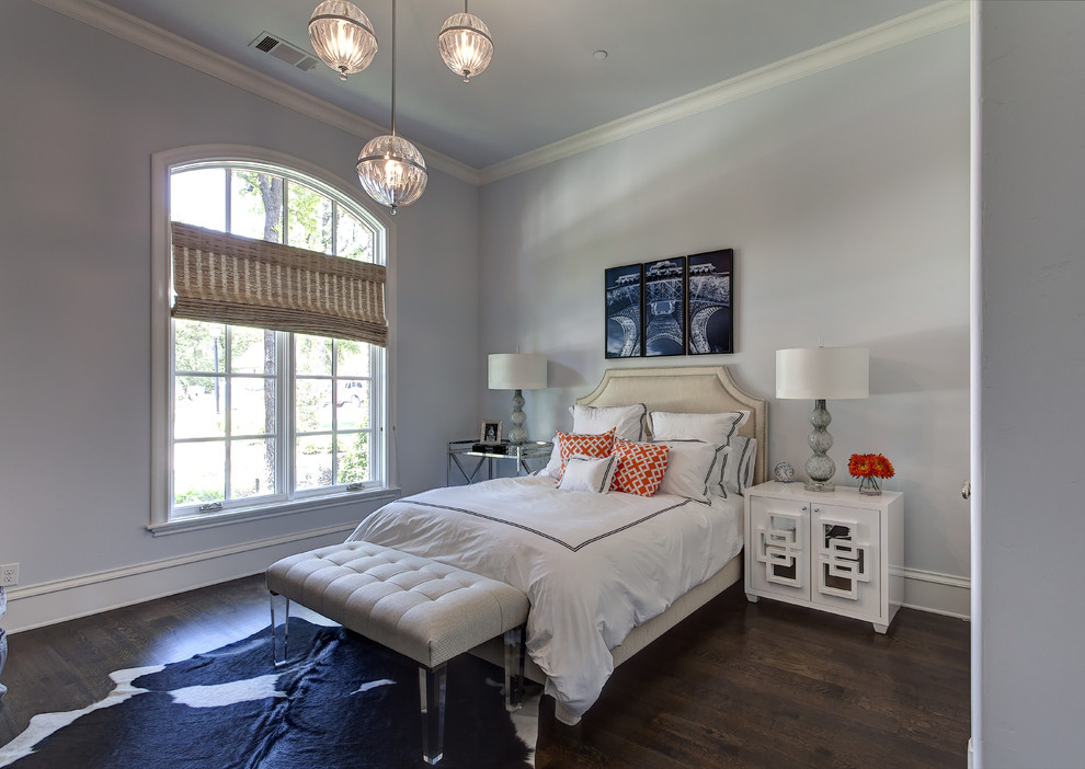 Photo of a traditional bedroom in Dallas with grey walls and dark hardwood floors.