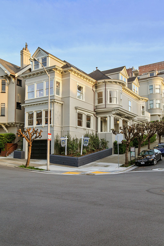 Expansive traditional three-storey grey exterior in San Francisco with wood siding and a gable roof.