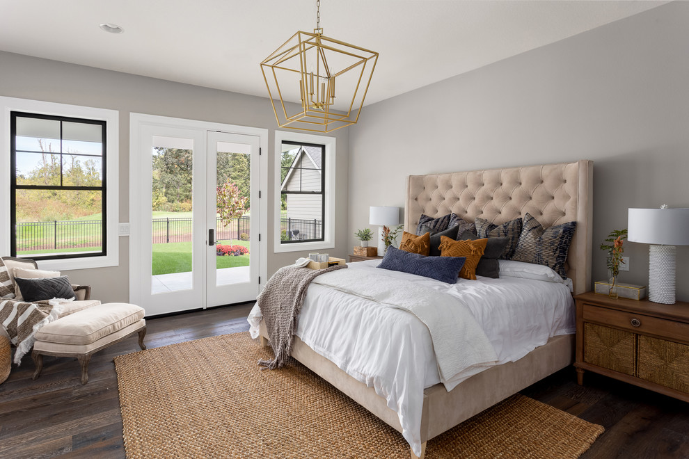 Design ideas for a transitional bedroom in Portland with grey walls, dark hardwood floors and brown floor.