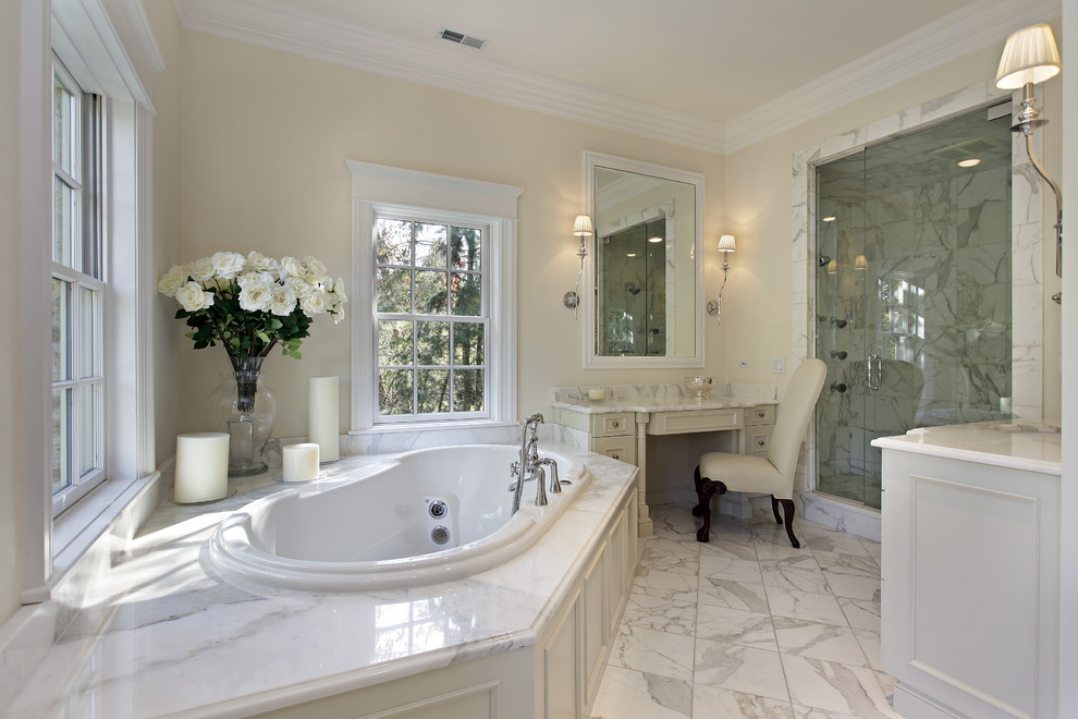 Large traditional master bathroom in Dallas with beaded inset cabinets, white cabinets, a drop-in tub, an alcove shower, marble benchtops, beige walls, marble floors, multi-coloured floor and a hinged shower door.