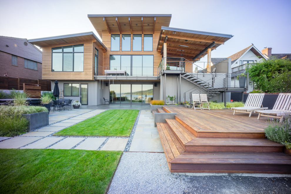 Inspiration for a contemporary two-storey exterior in Seattle with mixed siding and a shed roof.