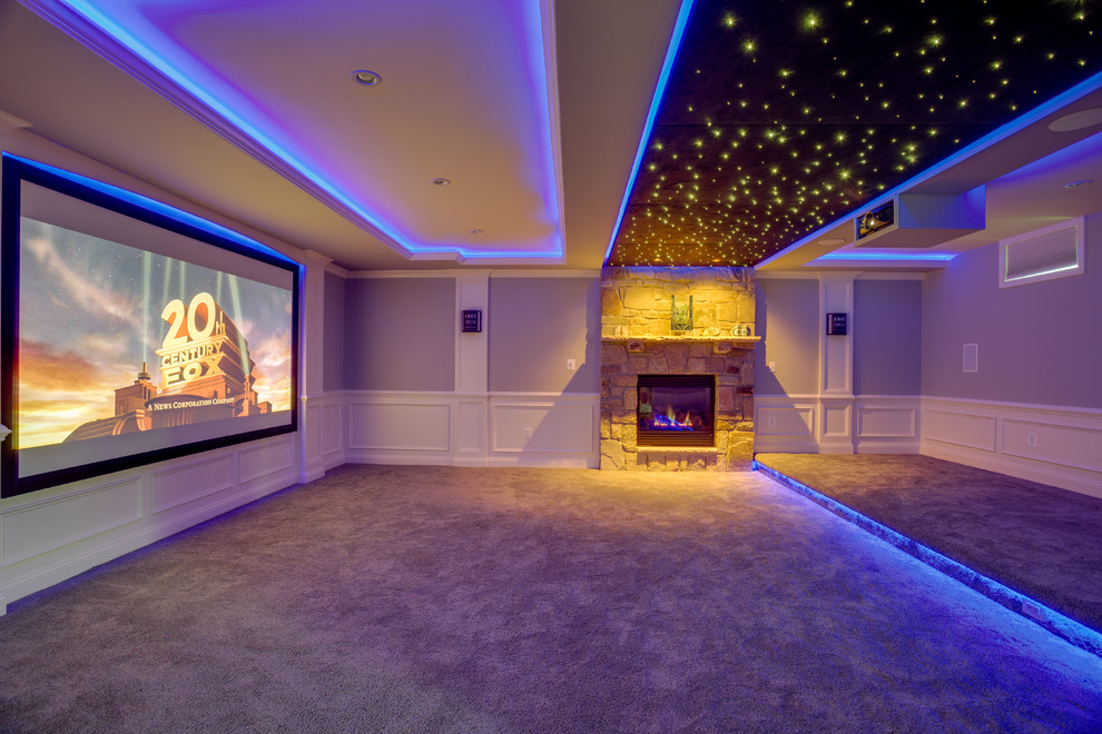 Photo of a large modern open concept home theatre in DC Metro with grey walls, carpet and a projector screen.