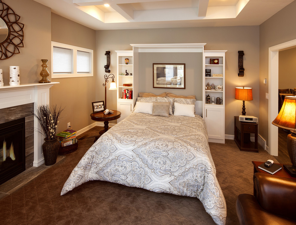 This is an example of a mid-sized traditional guest bedroom in DC Metro with grey walls, carpet, a standard fireplace, a tile fireplace surround and brown floor.