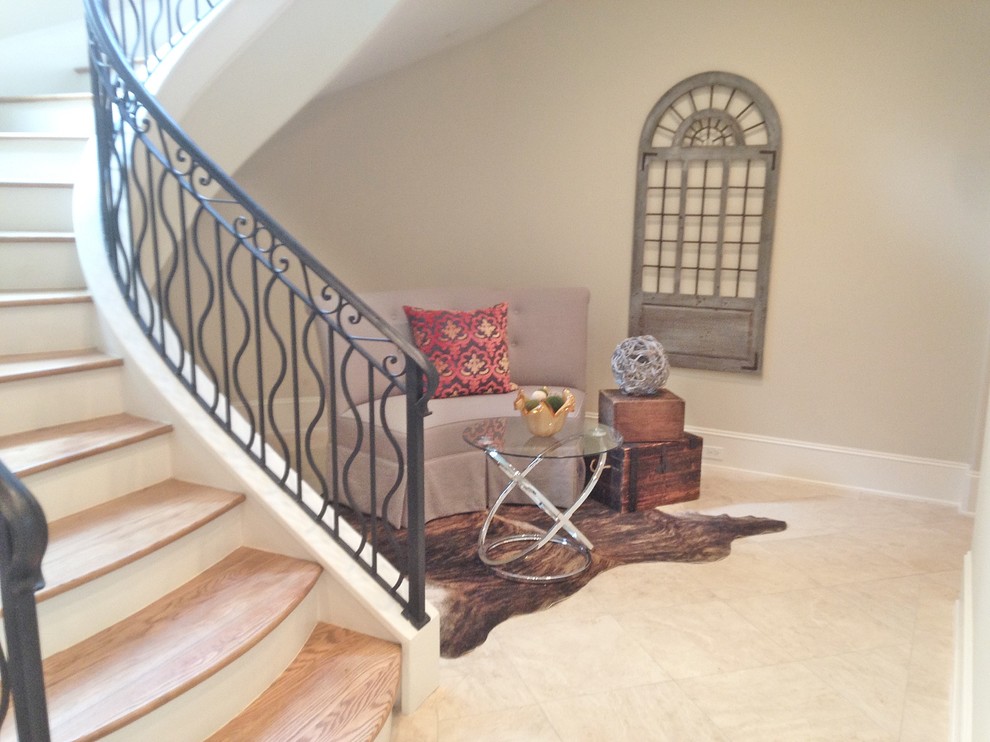 Mid-sized traditional foyer in Houston with beige walls, ceramic floors and beige floor.
