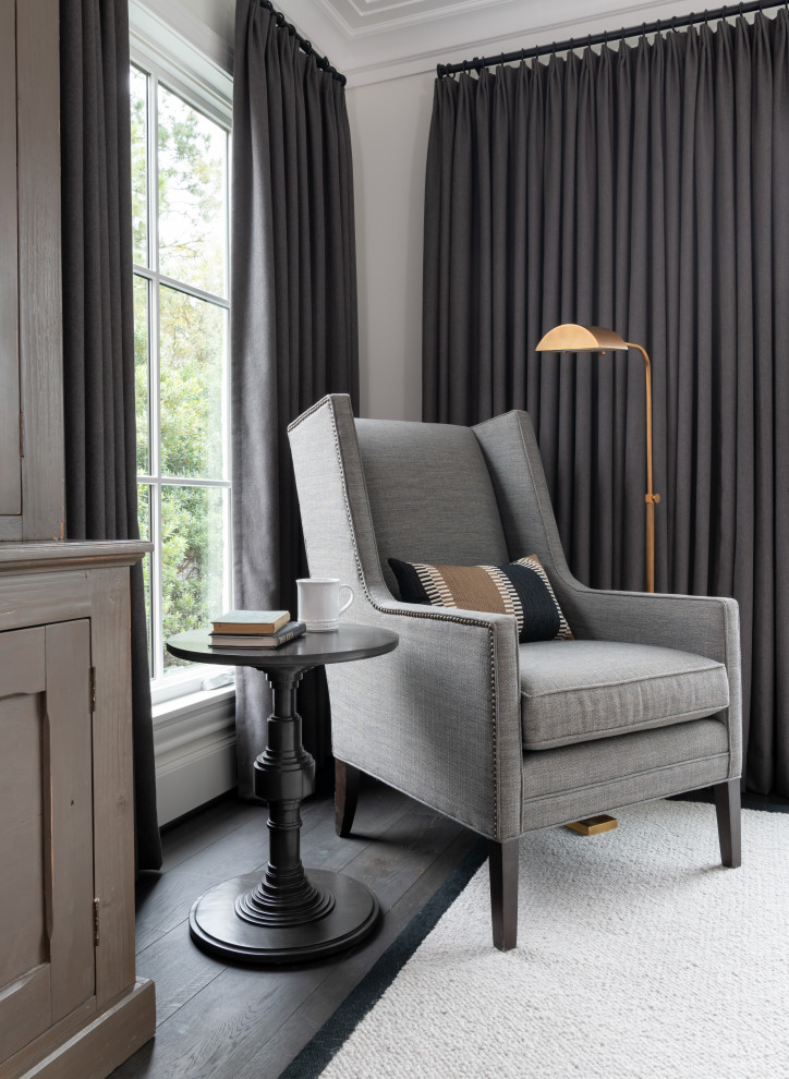 Example of a master bedroom design in Houston with white walls