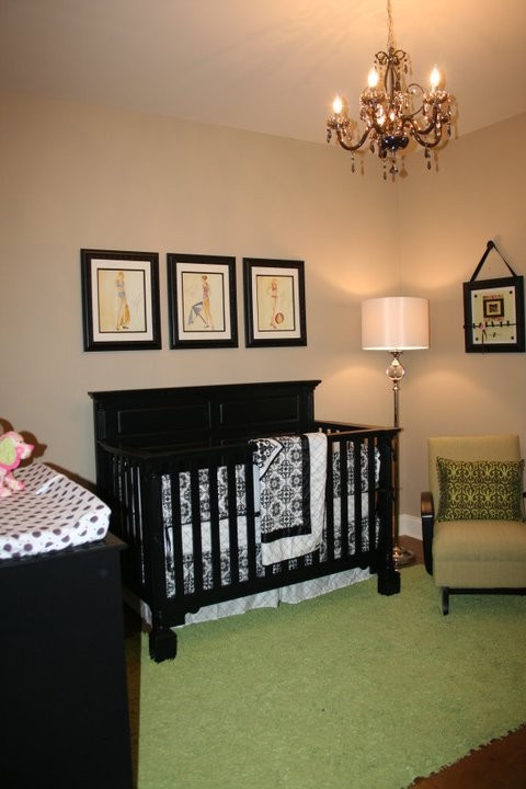 Photo of a small traditional kids' room for girls in New Orleans with beige walls and concrete floors.