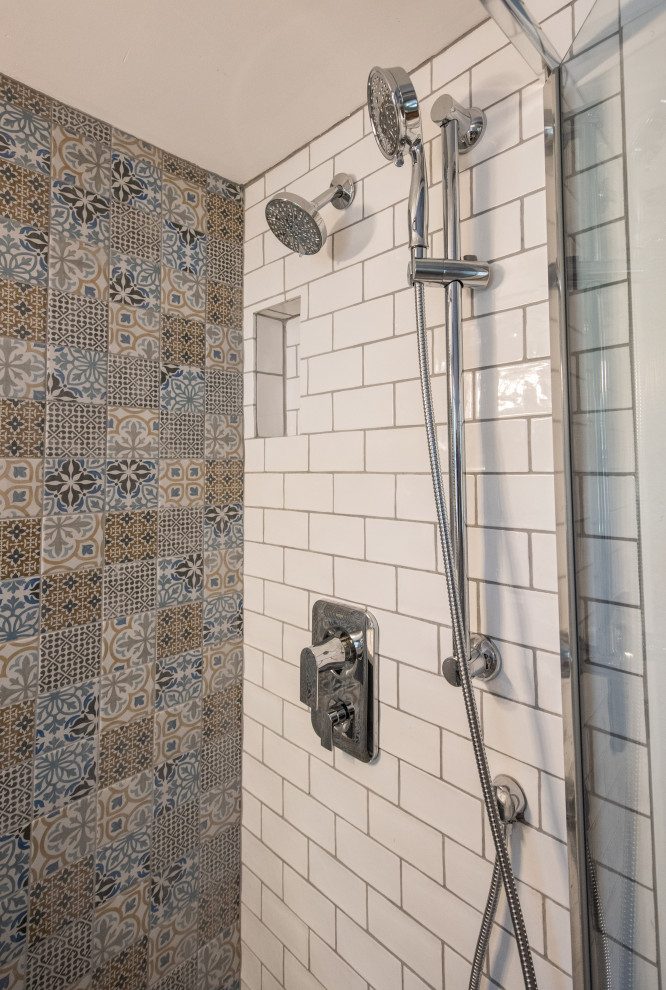 Inspiration for a small transitional ceramic tile ceramic tile, white floor and wainscoting powder room remodel in Denver with open cabinets, blue cabinets, a two-piece toilet, blue walls, an integrated sink, white countertops and a freestanding vanity
