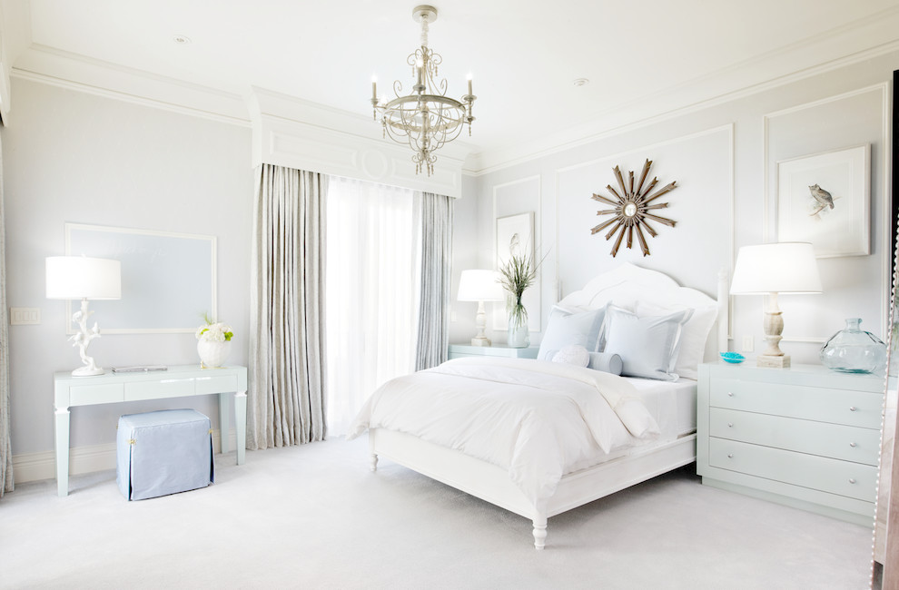 This is an example of a traditional bedroom in Las Vegas with grey walls and carpet.