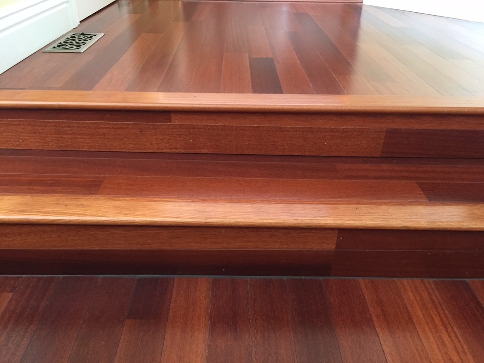 This is an example of an expansive traditional wood straight staircase in San Francisco with wood risers.