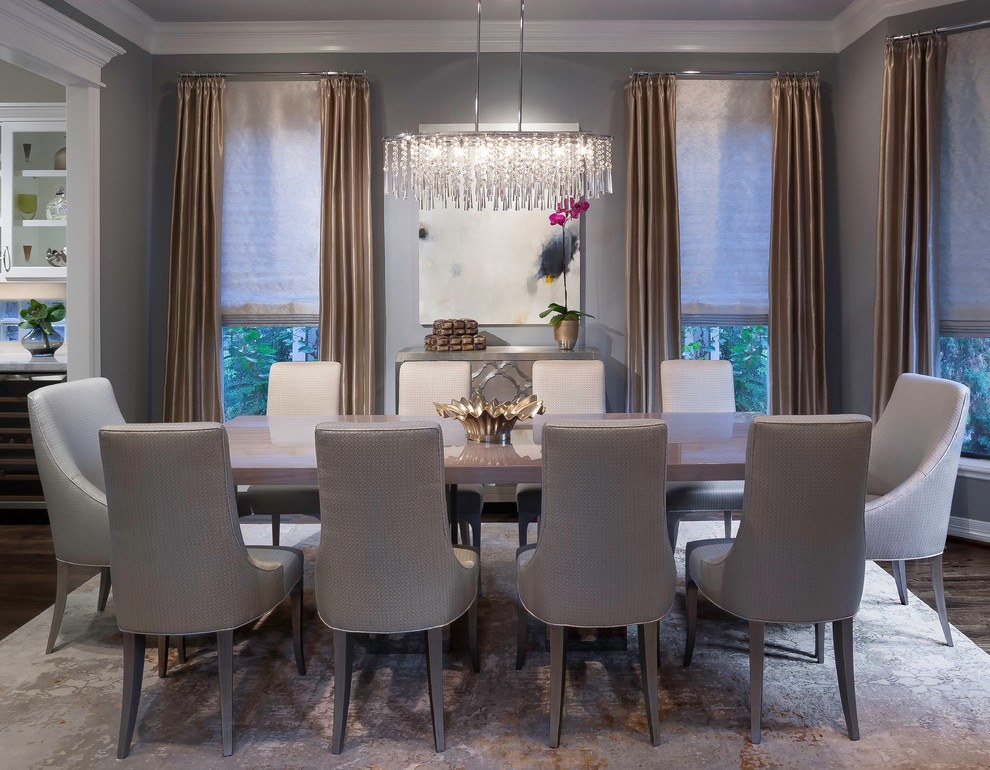 Example of a mid-sized transitional dark wood floor enclosed dining room design in Houston with gray walls and no fireplace