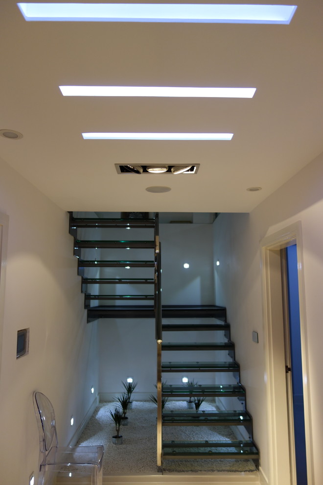 Design ideas for a contemporary u-shaped staircase in Manchester with open risers.