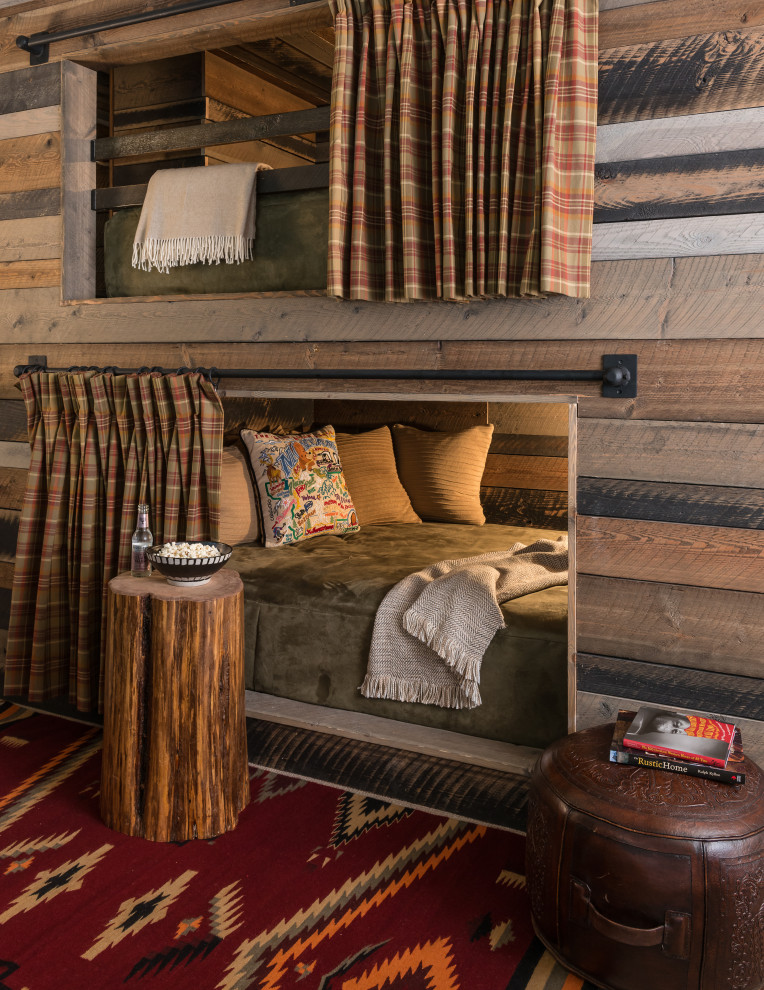 Rock Creek Remodel - Example of a bedroom mountain style wood wall kids' bedroom design with brown walls