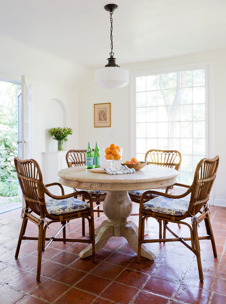 Country dining room in Los Angeles with white walls.
