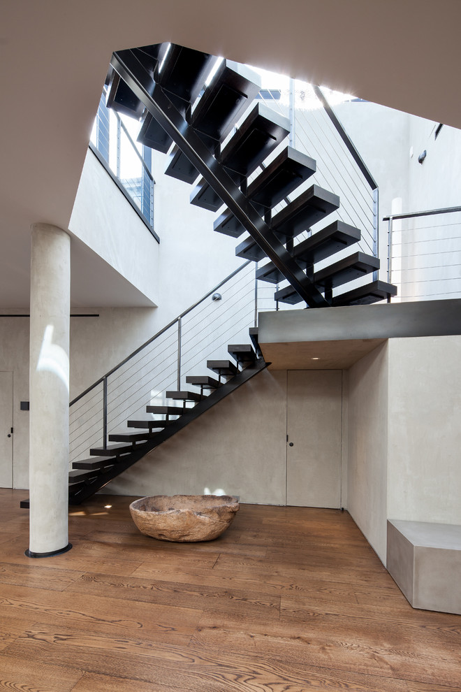 Photo of a contemporary staircase in New York with open risers.