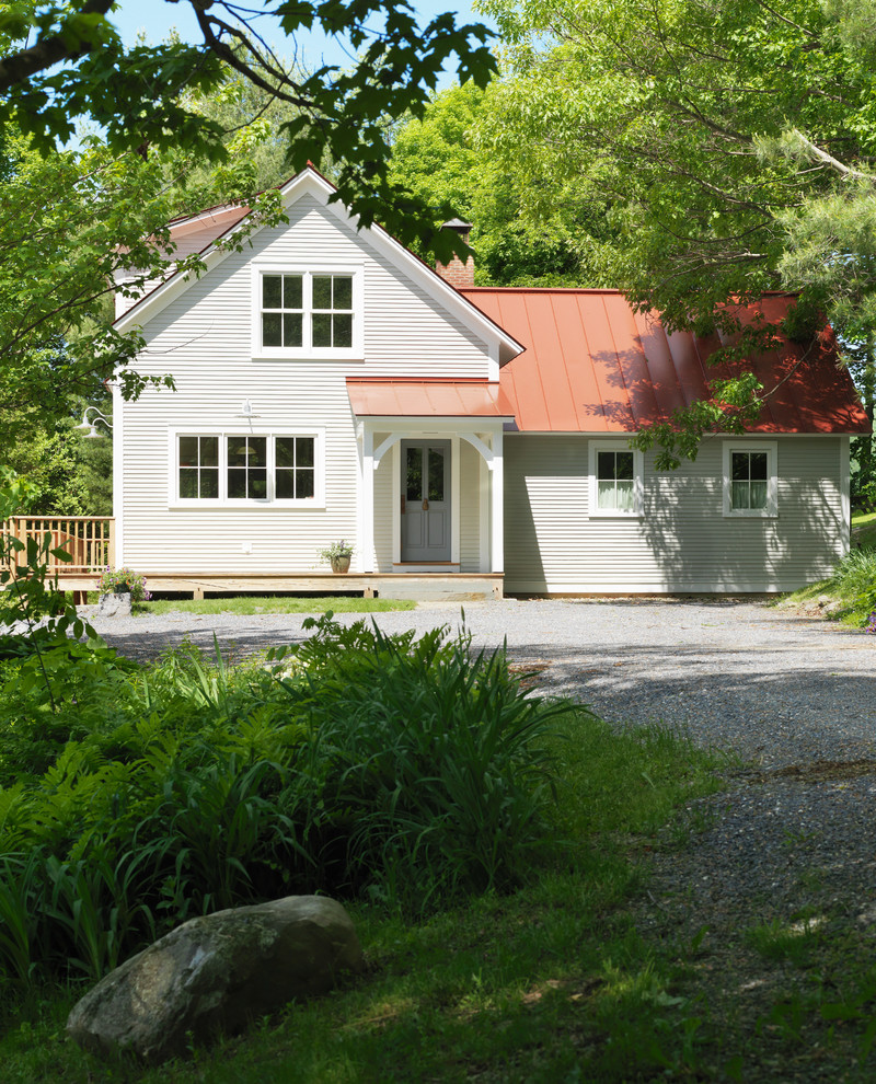 Large country beige two-story wood gable roof photo in Burlington