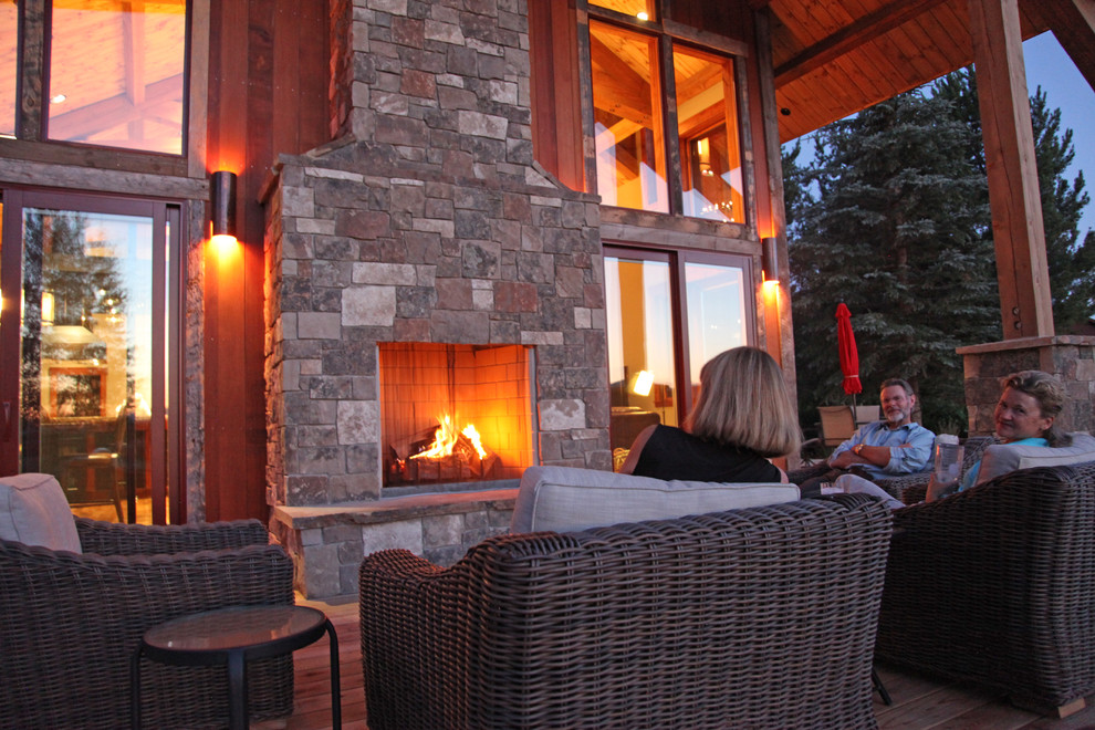 Home design - rustic backyard home design idea with a fire pit