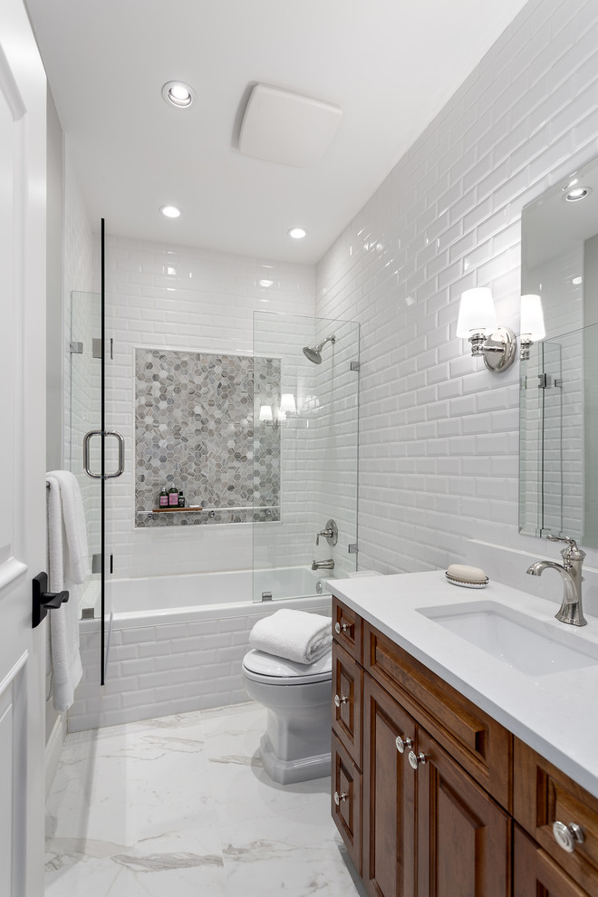 Design ideas for a mid-sized traditional 3/4 bathroom in Vancouver with raised-panel cabinets, medium wood cabinets, a drop-in tub, an open shower, white tile, ceramic tile, white walls, an undermount sink, quartzite benchtops, white floor and a hinged shower door.