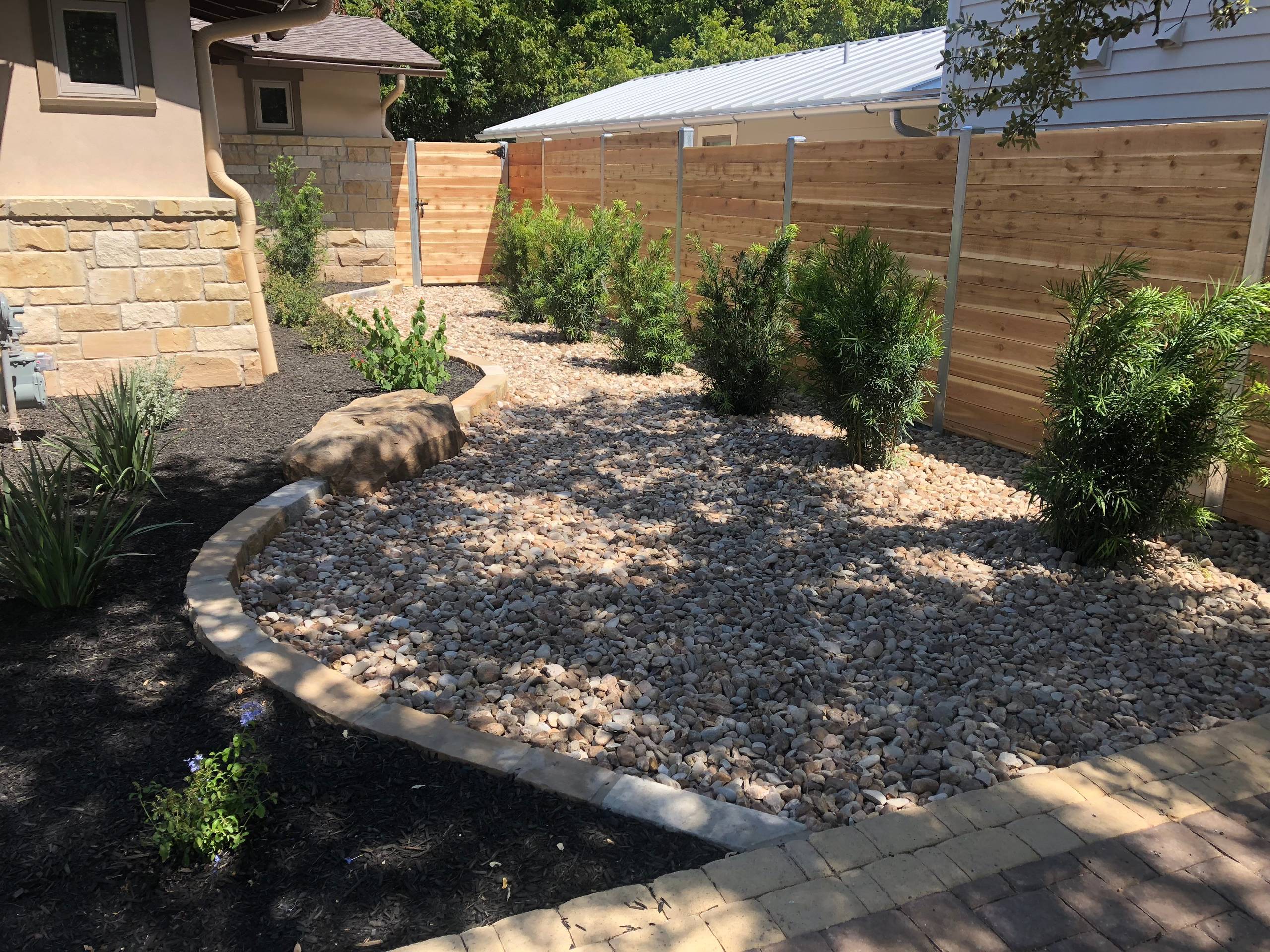 Combination of mulch and Colorado River Rock with "future" privacy shrubs