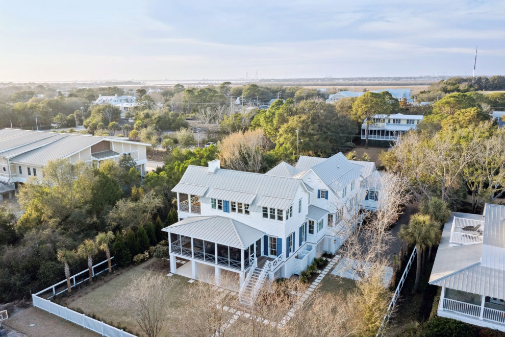 Historic Sea Cabins - Exterior of historic sea cabinet with cedar lap siding painted in Super White. Ash Grey hand-crimped metal roof.