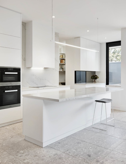 Create a Striking Contrast with Minimalist Kitchen Inspirations: All-White Design Featuring Gray Floor Tiles