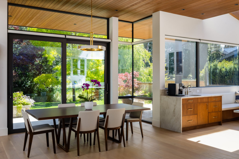 Inspiration for a large contemporary light wood floor, beige floor and wood ceiling great room remodel in Vancouver with white walls