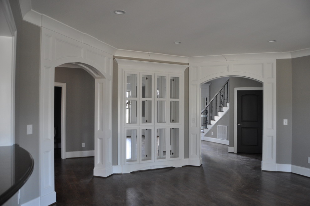 Example of a transitional dark wood floor living room design in Raleigh with gray walls