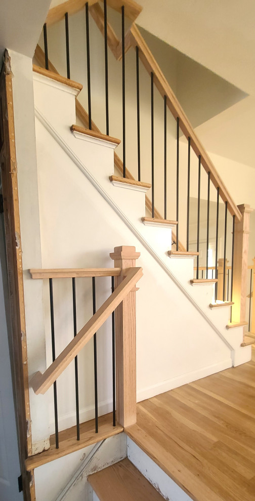 Inspiration for a mid-sized contemporary wood straight staircase in New York with wood risers and mixed railing.