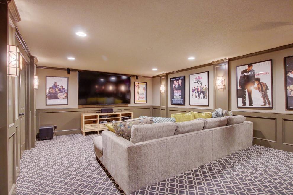 Inspiration for a large transitional enclosed home theatre in Kansas City with beige walls, carpet, a wall-mounted tv and multi-coloured floor.