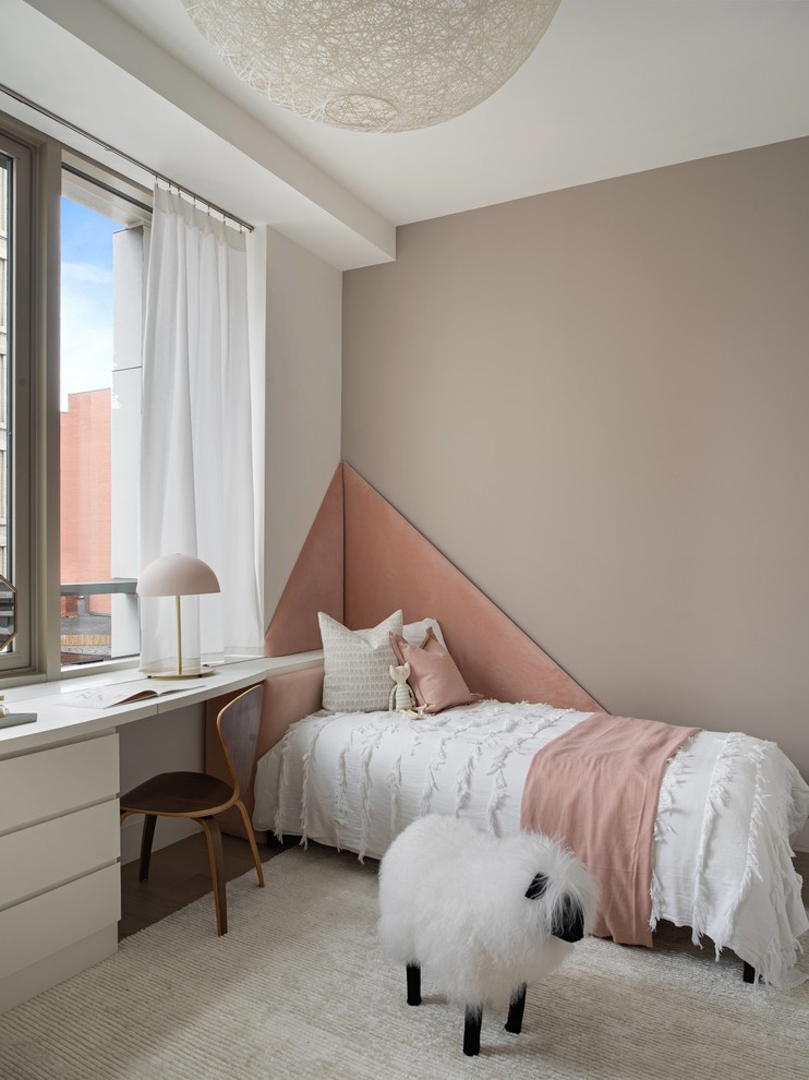 Inspiration for a contemporary kids' bedroom for kids 4-10 years old and girls in New York with brown walls.