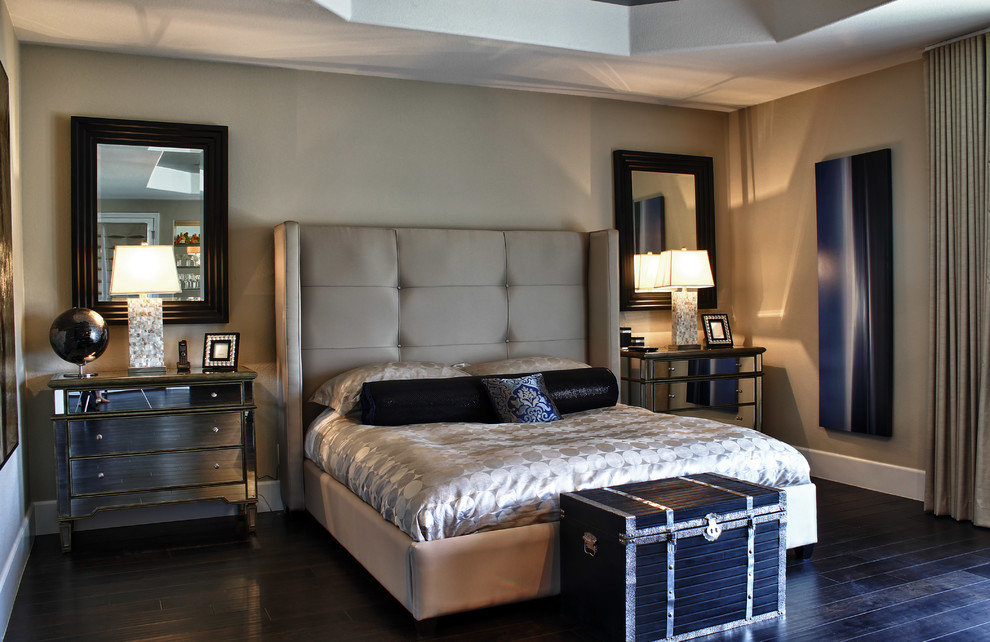 This is an example of a traditional bedroom in Las Vegas with grey walls and dark hardwood floors.
