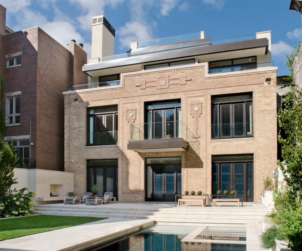 Large contemporary three-storey brick exterior in Chicago with a flat roof.