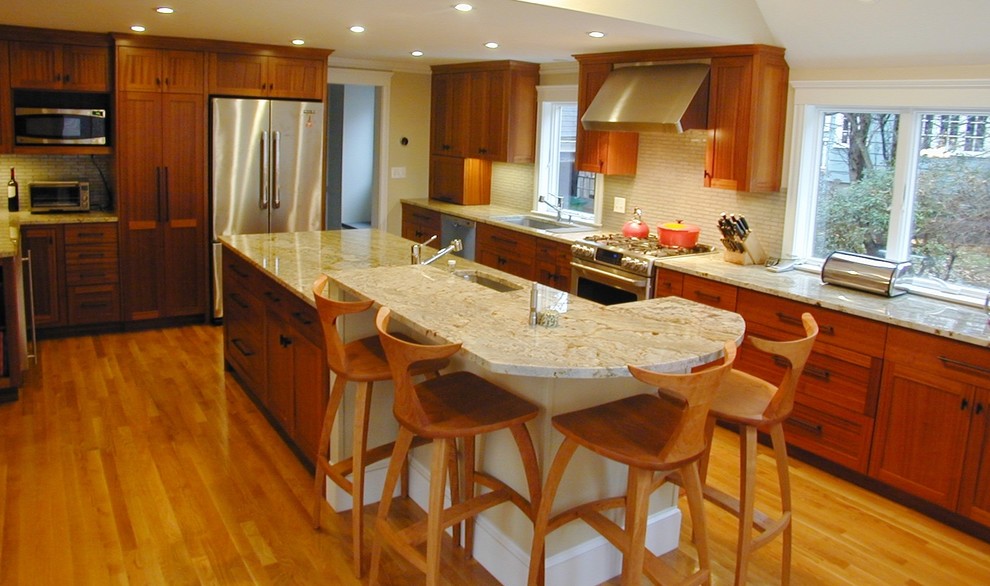 Example of a large transitional u-shaped light wood floor enclosed kitchen design in Boston with an undermount sink, shaker cabinets, dark wood cabinets, granite countertops, white backsplash, glass tile backsplash, stainless steel appliances and an island