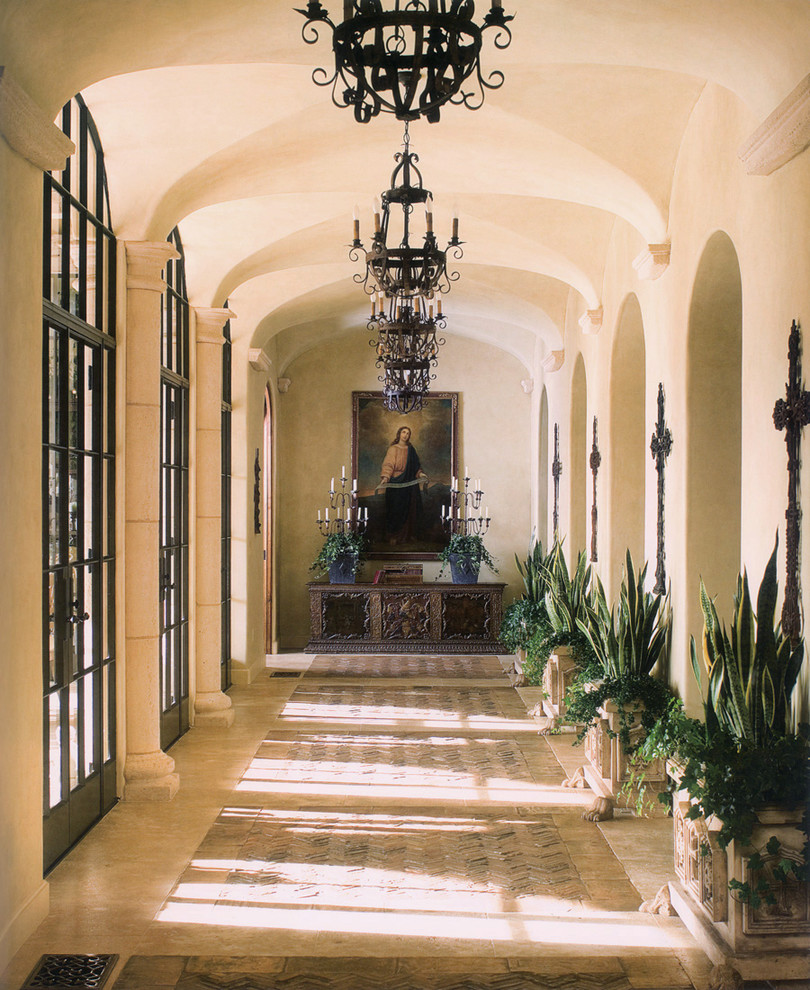 Photo of a mediterranean hallway in San Diego with beige walls and beige floor.