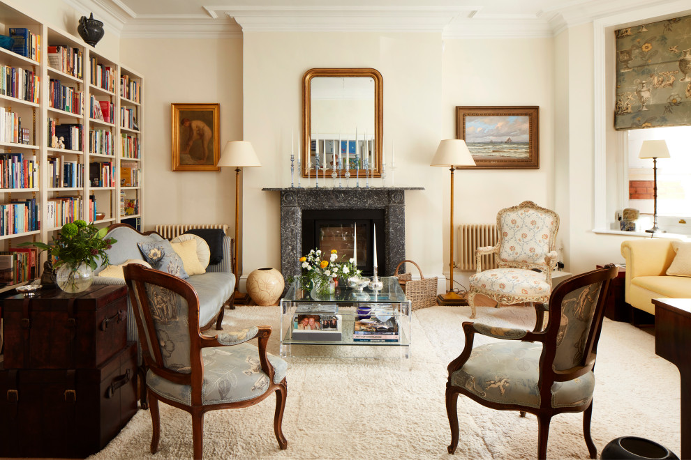 Inspiration for a medium sized eclectic formal enclosed living room in London with beige walls, a standard fireplace, a stone fireplace surround and beige floors.