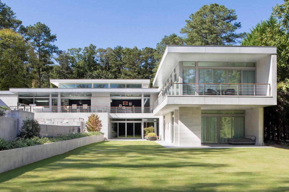 Inspiration for a large modern two-storey house exterior in Atlanta with a flat roof.
