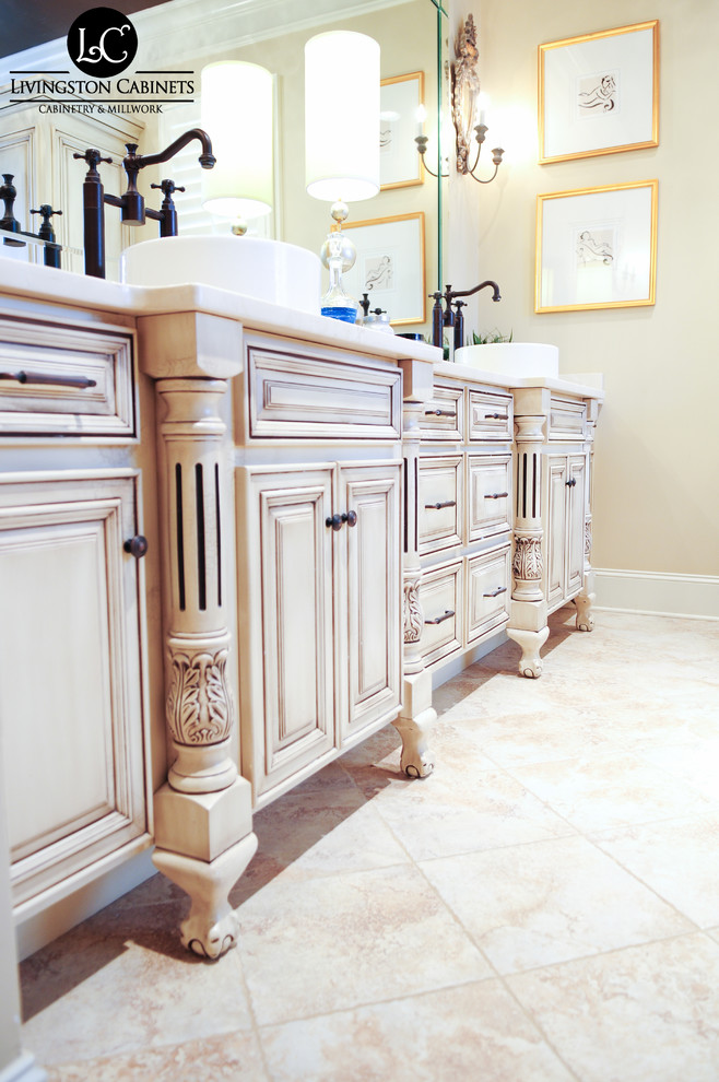 Inspiration for a large traditional master bathroom in Birmingham with a vessel sink, raised-panel cabinets, beige cabinets, granite benchtops, beige tile and beige walls.