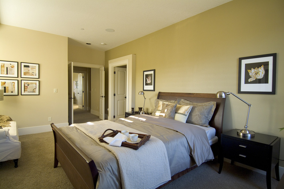 Inspiration for a contemporary bedroom in Portland with beige walls and carpet.