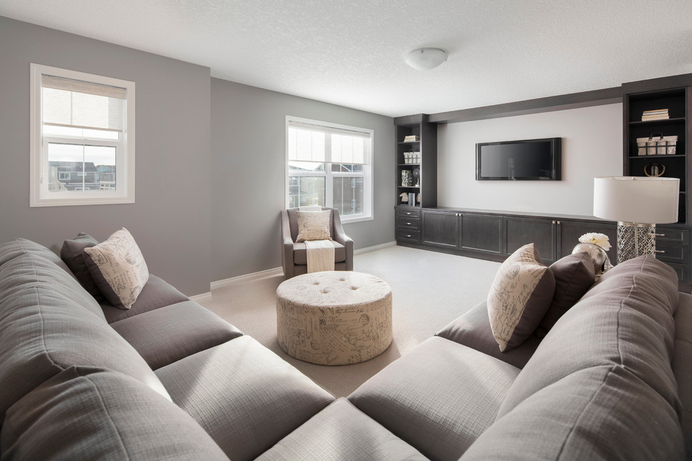 Mid-sized traditional enclosed family room in Calgary with grey walls, carpet, no fireplace and a wall-mounted tv.