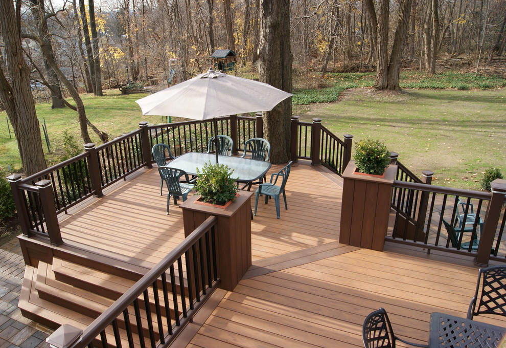 Inspiration for an expansive traditional backyard deck in New York with a water feature.