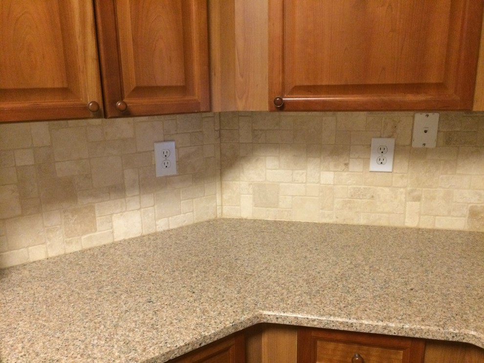 Example of a kitchen design in DC Metro with beaded inset cabinets, medium tone wood cabinets and beige backsplash