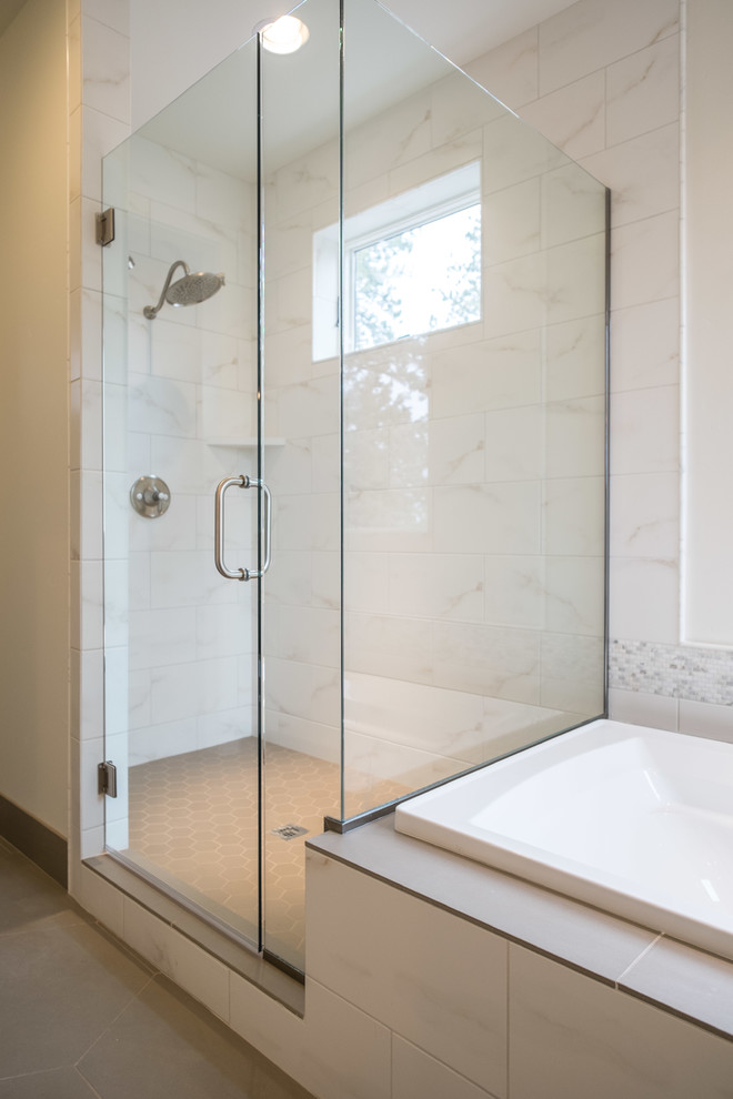 Inspiration for a mid-sized transitional master porcelain tile porcelain tile drop-in bathtub remodel with a drop-in sink, shaker cabinets and white cabinets