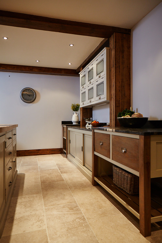This is an example of a large traditional l-shaped eat-in kitchen in Other with an undermount sink, beaded inset cabinets, beige cabinets, wood benchtops, grey splashback, metal splashback, coloured appliances, ceramic floors, with island and beige floor.