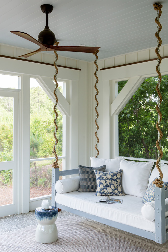 Inspiration for a mid-sized country backyard screened-in verandah in Charleston with a roof extension.
