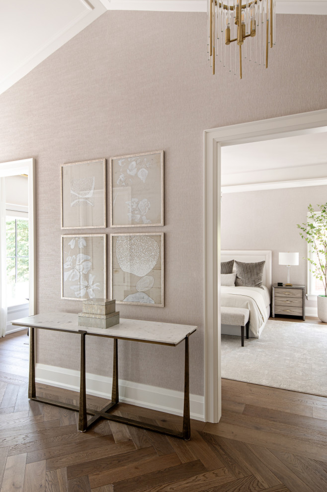 Example of a mid-sized transitional light wood floor and wallpaper hallway design in Toronto with beige walls
