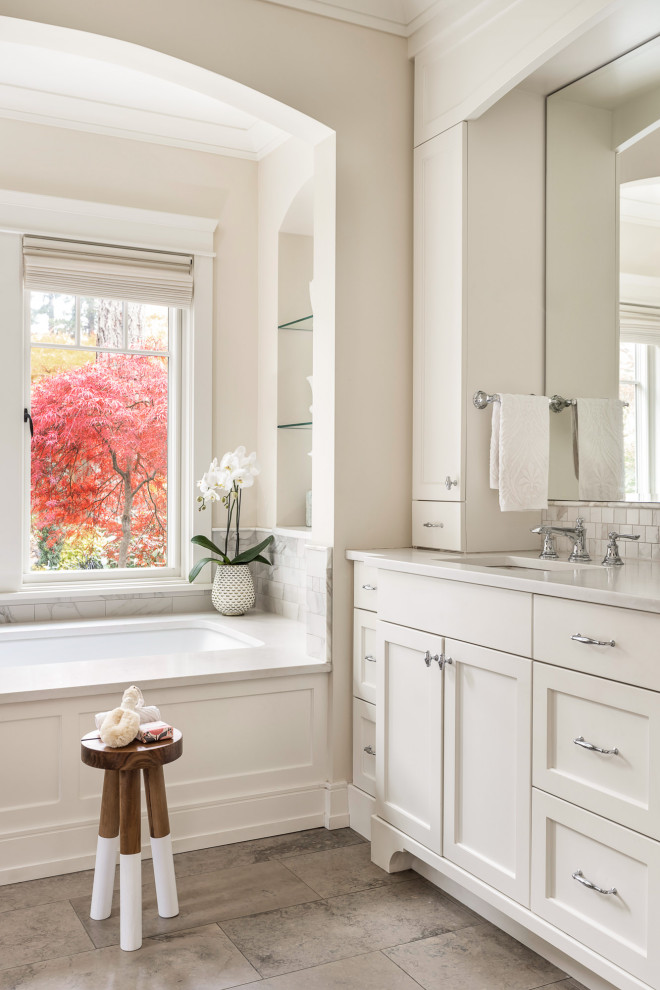 Inspiration for a transitional master bathroom in Portland with shaker cabinets, white cabinets, an undermount tub, white walls, an undermount sink, beige floor, white benchtops, a single vanity and a built-in vanity.